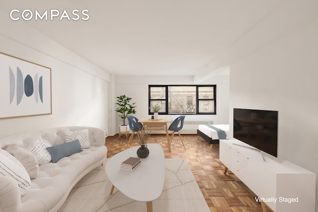 living room with parquet flooring and radiator heating unit