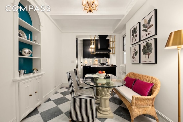 dining space with built in features and ornamental molding