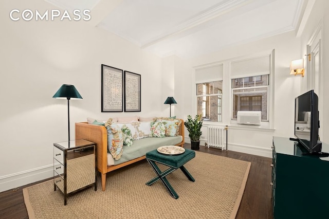 living room with radiator heating unit, dark hardwood / wood-style floors, and crown molding