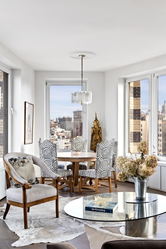 dining room featuring hardwood / wood-style flooring and a notable chandelier