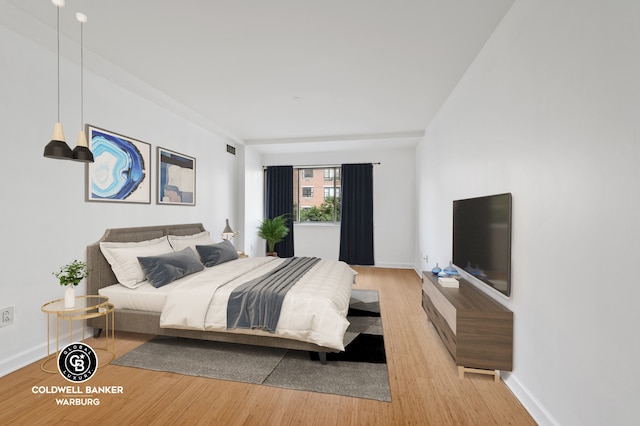 bedroom with light hardwood / wood-style floors