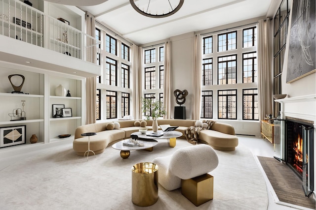 living area with carpet and a high ceiling