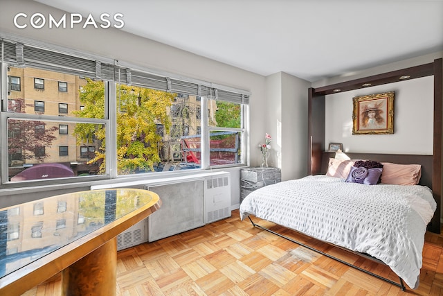 bedroom featuring light parquet floors