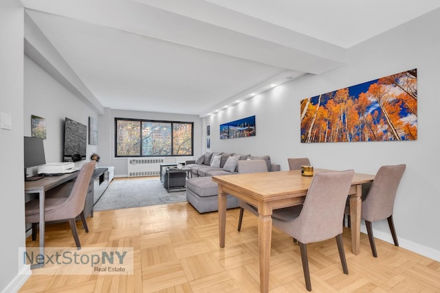 dining room with radiator and light parquet flooring