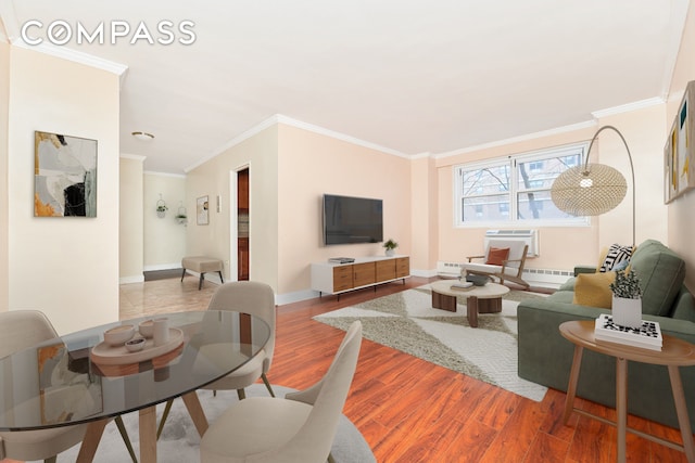 living room featuring wood-type flooring and ornamental molding