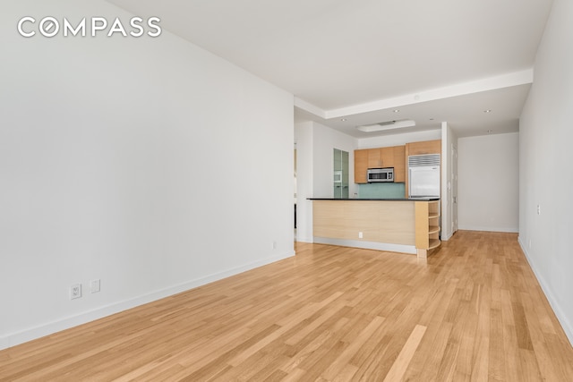 unfurnished living room with light wood-type flooring