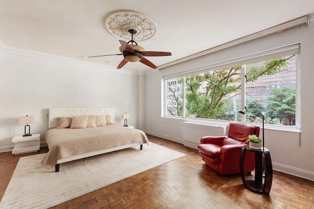 bedroom featuring parquet floors, ceiling fan, and ornamental molding