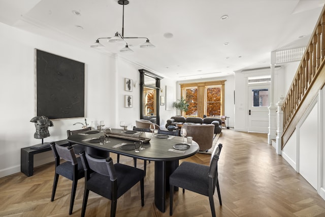 dining space with light parquet flooring