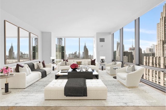 living room featuring plenty of natural light and light hardwood / wood-style floors