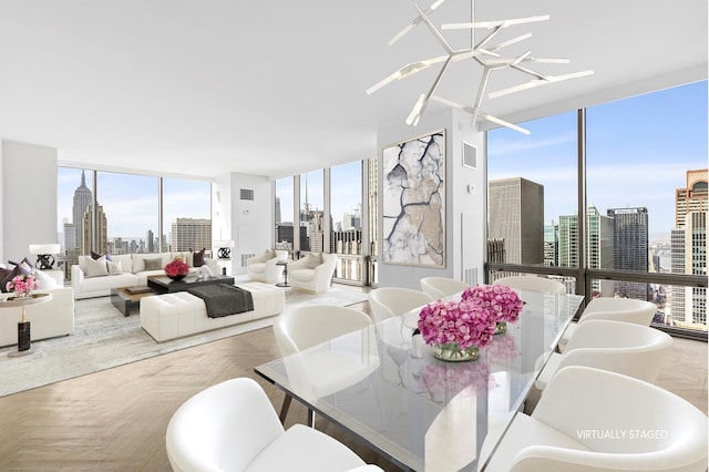 dining area featuring plenty of natural light, floor to ceiling windows, and light parquet floors