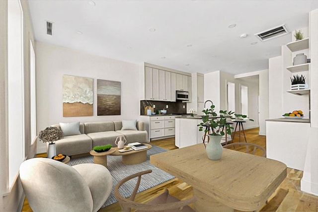 living room with light hardwood / wood-style floors