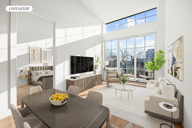 living room featuring hardwood / wood-style flooring and a high ceiling