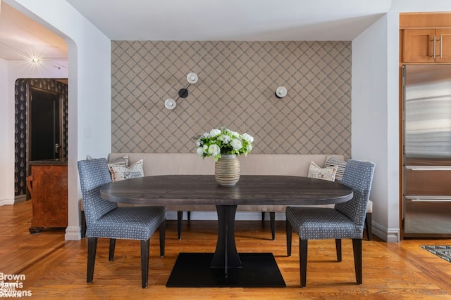 dining space featuring breakfast area and light hardwood / wood-style floors