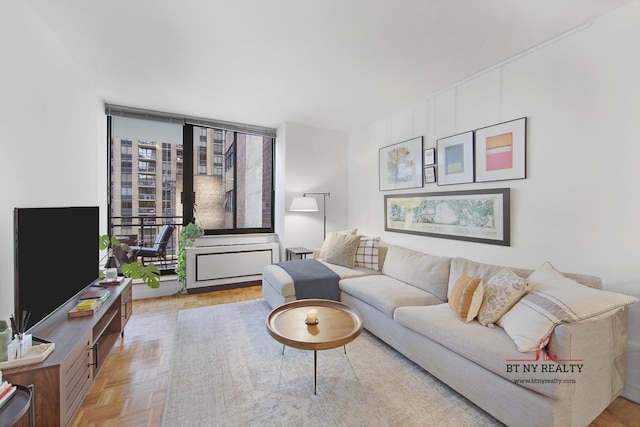 living room featuring light parquet floors