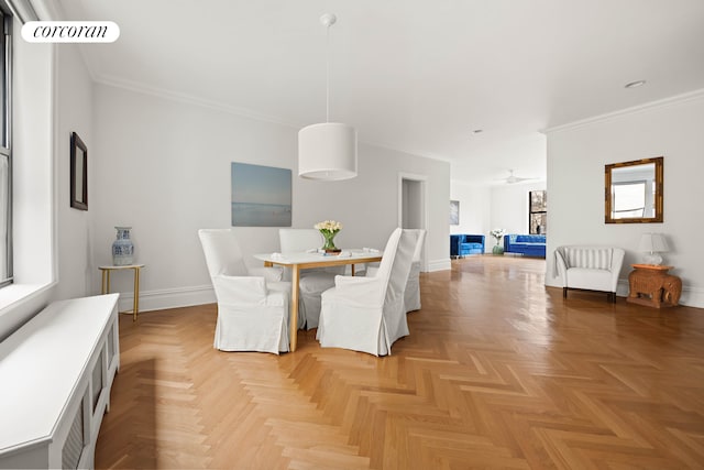 dining area with plenty of natural light, ceiling fan, and light parquet floors