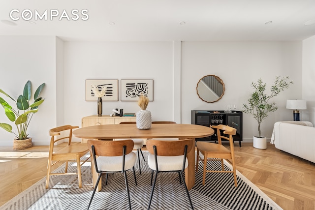 dining area featuring parquet floors