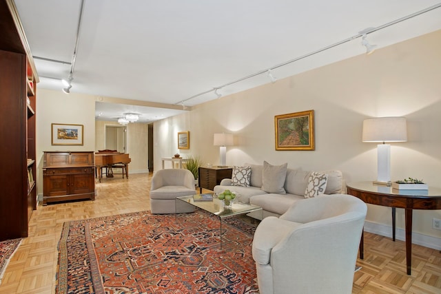 living room featuring light parquet flooring and track lighting