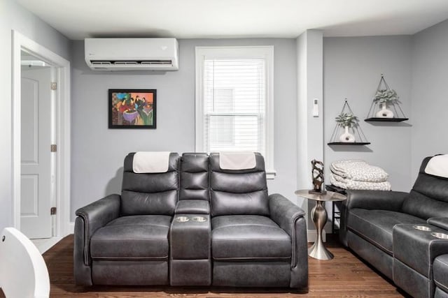 living room featuring a wall mounted air conditioner and hardwood / wood-style flooring