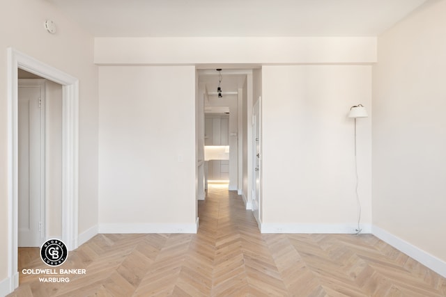 unfurnished room with light parquet floors