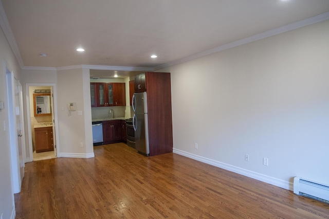 unfurnished living room featuring crown molding, sink, dark wood-type flooring, and a baseboard heating unit