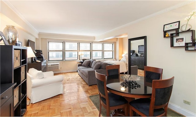 living room featuring ornamental molding, a wall unit AC, and light parquet flooring