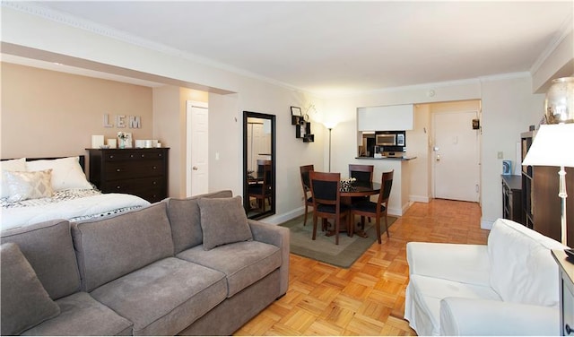 living room with crown molding and light parquet flooring