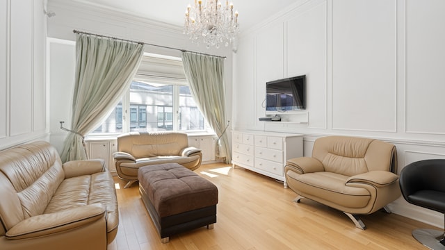 sitting room featuring light hardwood / wood-style floors and a notable chandelier