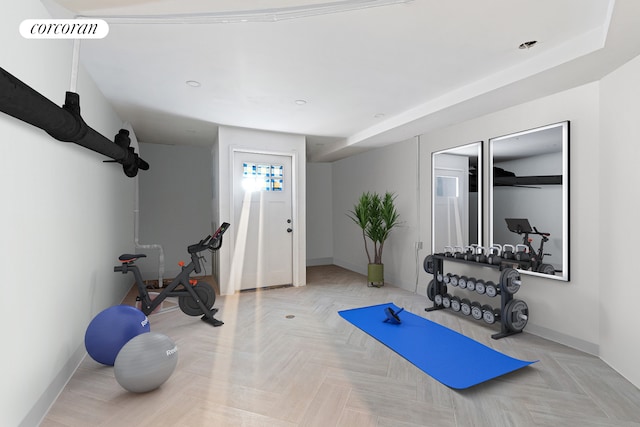 workout room with light parquet flooring