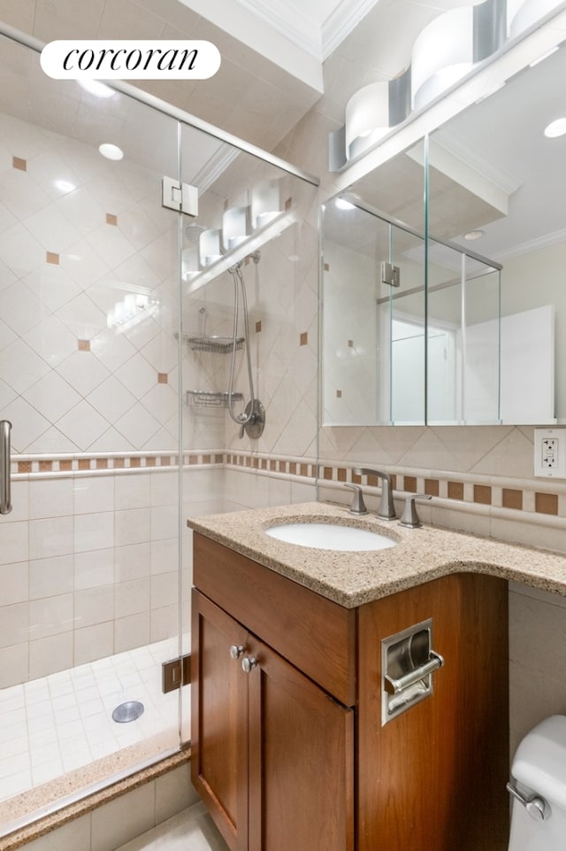 bathroom with vanity, crown molding, decorative backsplash, toilet, and walk in shower