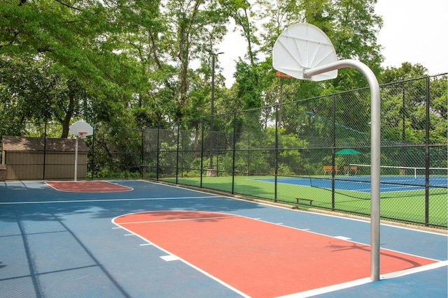 view of basketball court featuring tennis court