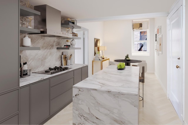 kitchen featuring wall chimney range hood, decorative backsplash, ornamental molding, black cooktop, and light parquet flooring