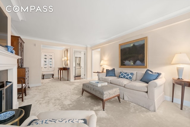 living room featuring crown molding and light colored carpet