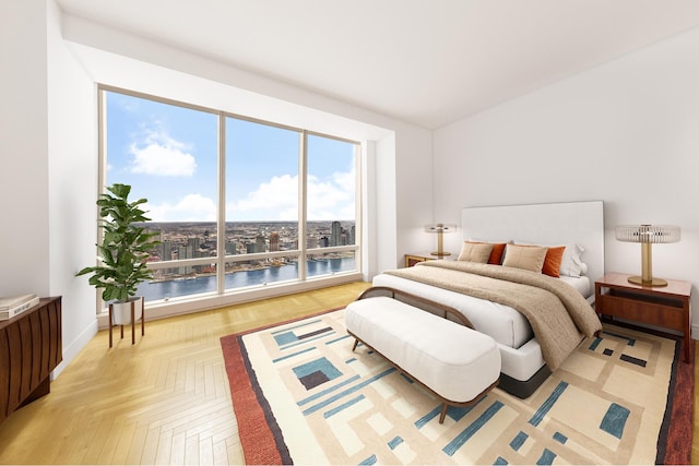 bedroom with a water view and parquet flooring