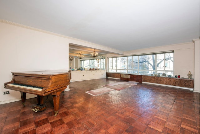 miscellaneous room with a chandelier, ornamental molding, dark parquet floors, and beamed ceiling