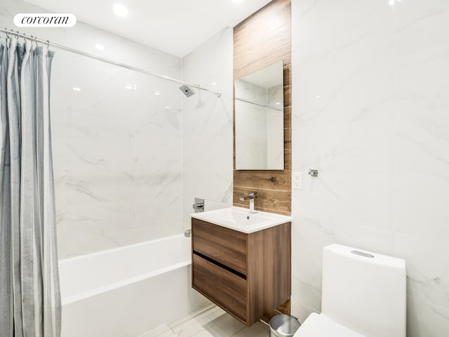 full bathroom featuring vanity, shower / bathtub combination with curtain, toilet, and tile walls