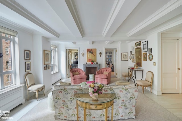 living room featuring light hardwood / wood-style flooring and crown molding