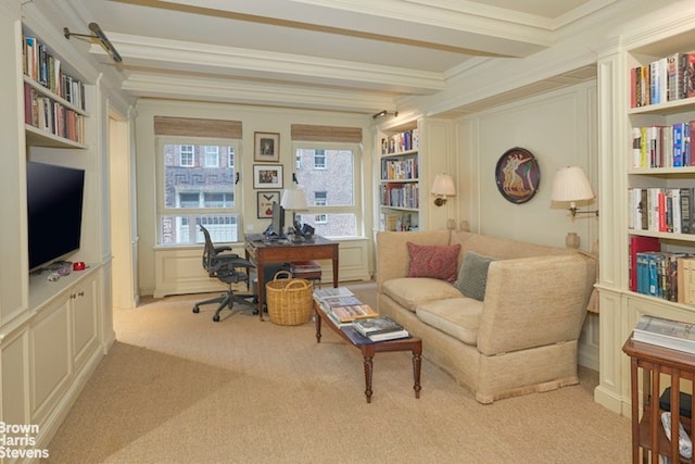 office with light carpet, built in features, beamed ceiling, and ornamental molding