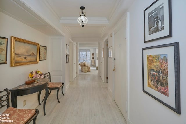 hallway with light hardwood / wood-style floors