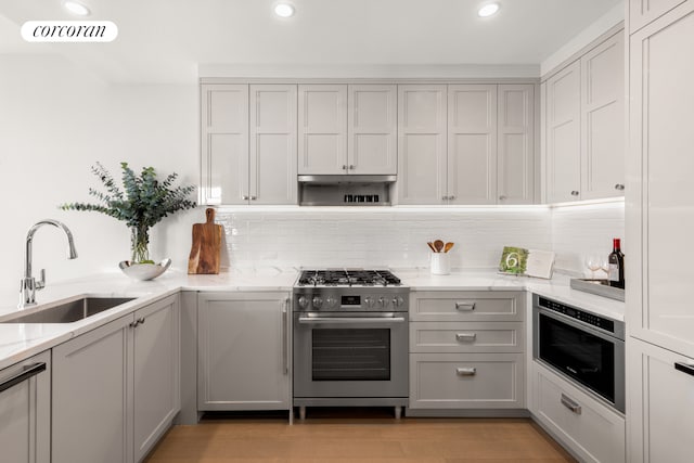 kitchen with gray cabinets, sink, and appliances with stainless steel finishes