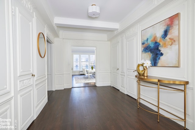 hall with crown molding and dark wood-type flooring