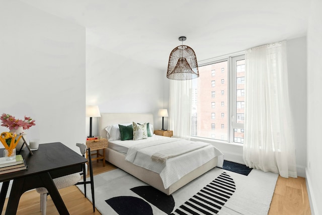 bedroom featuring wood-type flooring