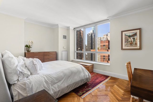 bedroom with parquet floors and ornamental molding