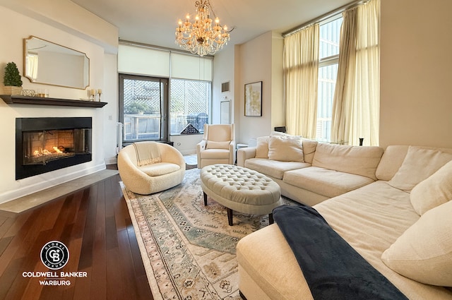 living room with wood-type flooring and a notable chandelier