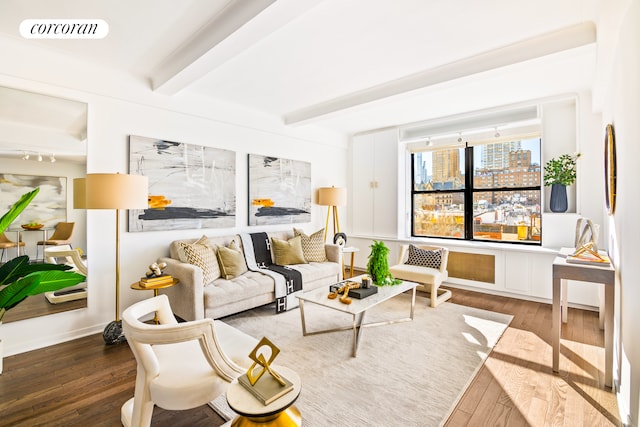 living room featuring beam ceiling and hardwood / wood-style flooring