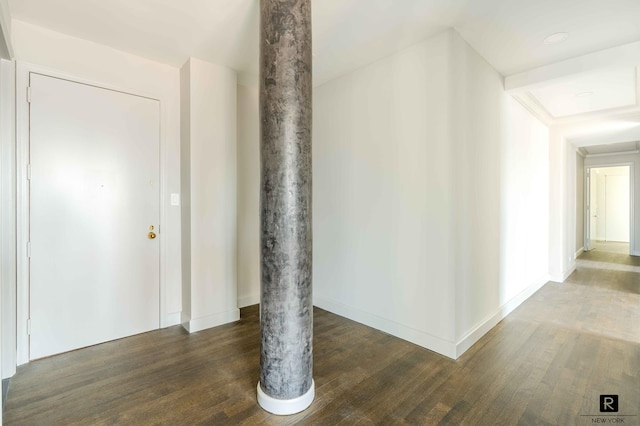 corridor with dark hardwood / wood-style floors