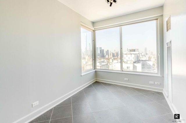 view of tiled spare room