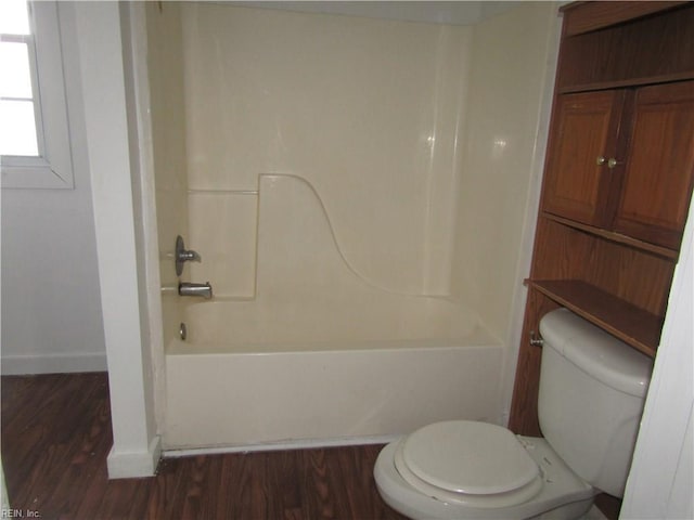 403 S Church St, Smithfield, VA 23430 - bathroom featuring bathing tub / shower combination, toilet, and hardwood / wood-style flooring