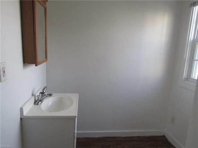 403 S Church St, Smithfield, VA 23430 - bathroom featuring vanity with extensive cabinet space and hardwood / wood-style floors