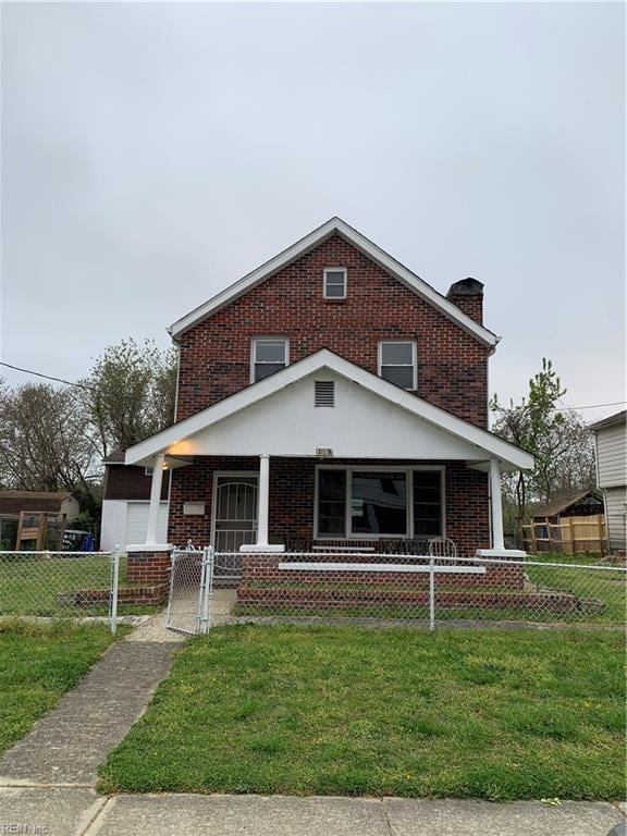 view of front facade featuring covered porch and a front yard