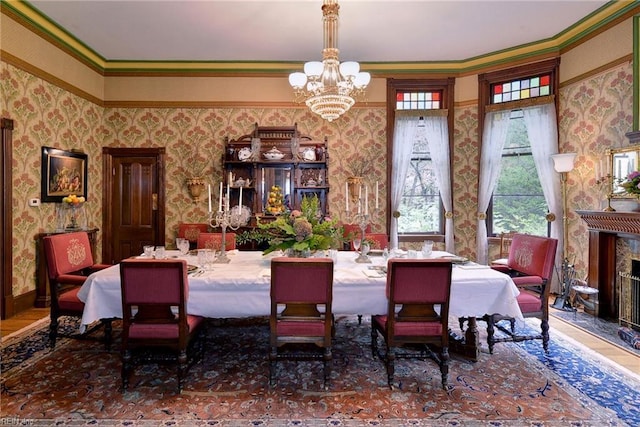 dining room featuring an inviting chandelier, crown molding, and a wealth of natural light